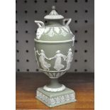 A Wedgwood dipped green jasperware vase and cover decorated with dancers,