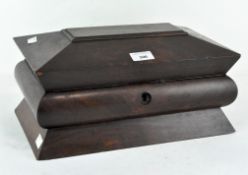 A 19th century rosewood tea caddy with splayed lid and foot and fitted interior,