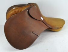 A 17 inch English honey-coloured leather saddle,