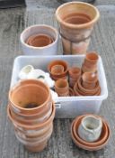 A large quantity of terracotta plant pots, of assorted shapes and sizes,