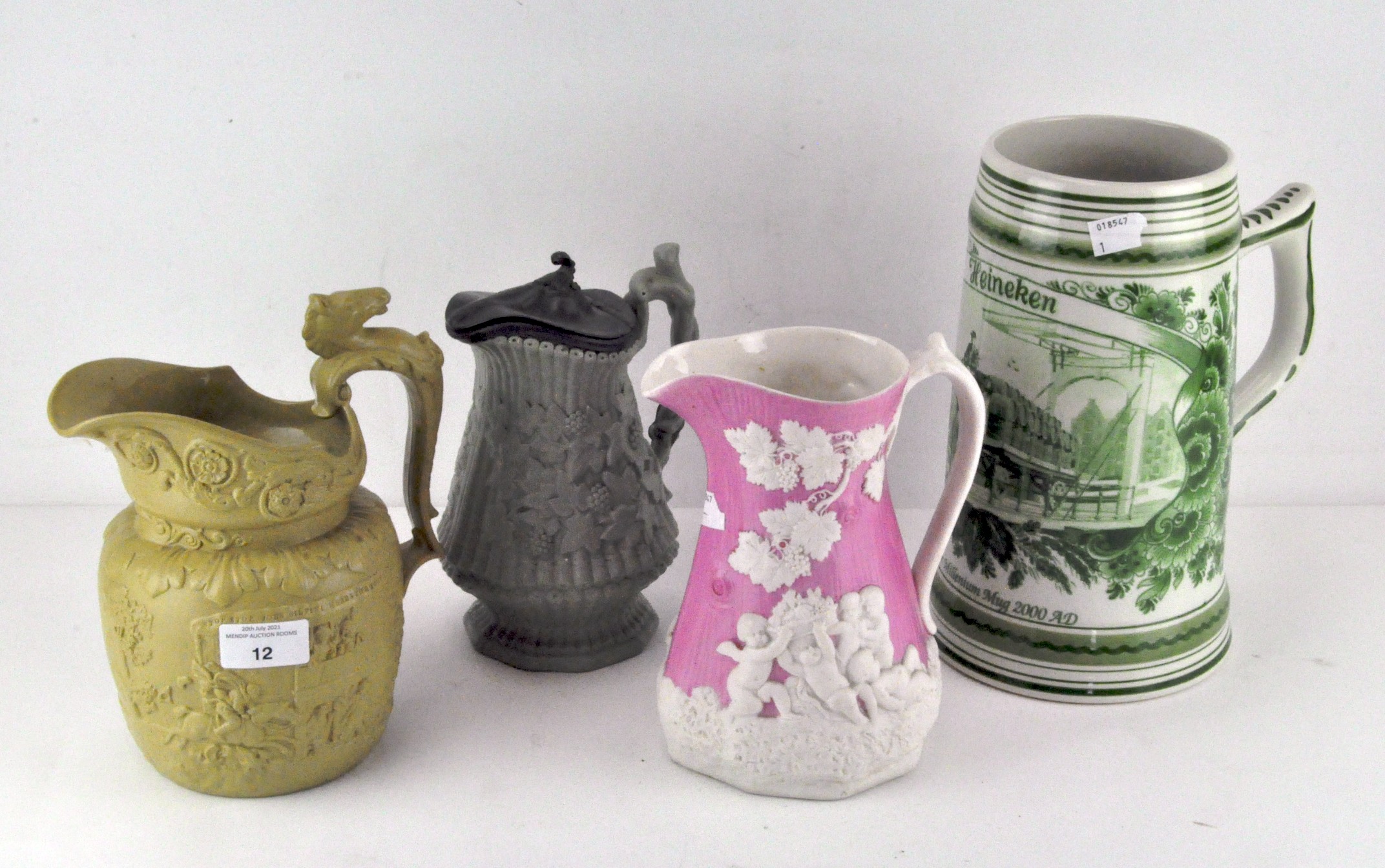 Three Staffordshire relief moulded stoneware or pottery jugs, including a Ridgway jug