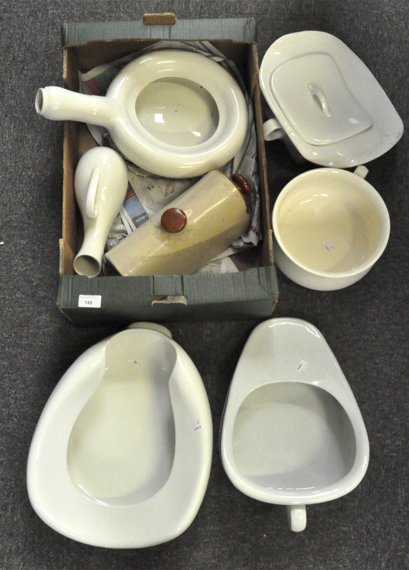 A collection of chamber pots and bed pans to include a Bristol slipper chamber pot