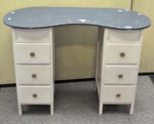 A 20th century blue and pale grey dressing table with kidney top above six drawers,