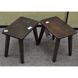 A pair of dark stained wood retro stools,