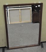 A late 19th century mahogany beveled edge wall mirror,