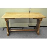 An early 20th century oak arts and crafts dining table of rectangular form,