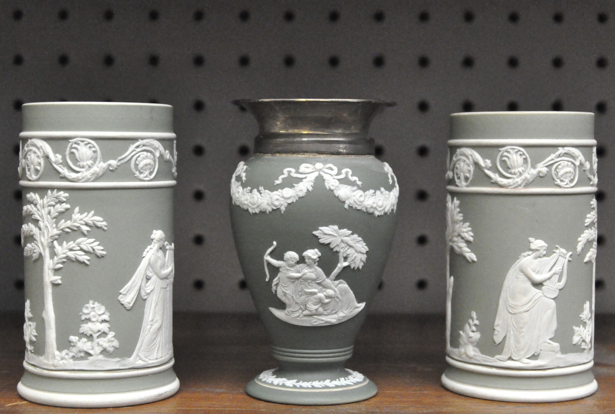 A small pair of Wedgwood dipped green jasperware cylindrical vases,