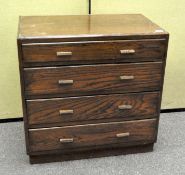 A mid century four drawer oak chest of drawers,