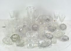 A large selection of vintage and contemporary cut glassware including glasses, dishes,