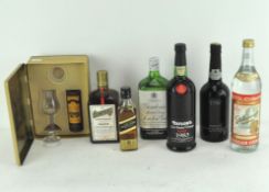 A collection of spirits including a miniature bottle of Glenmorangie 10 year old Scotch Whisky,