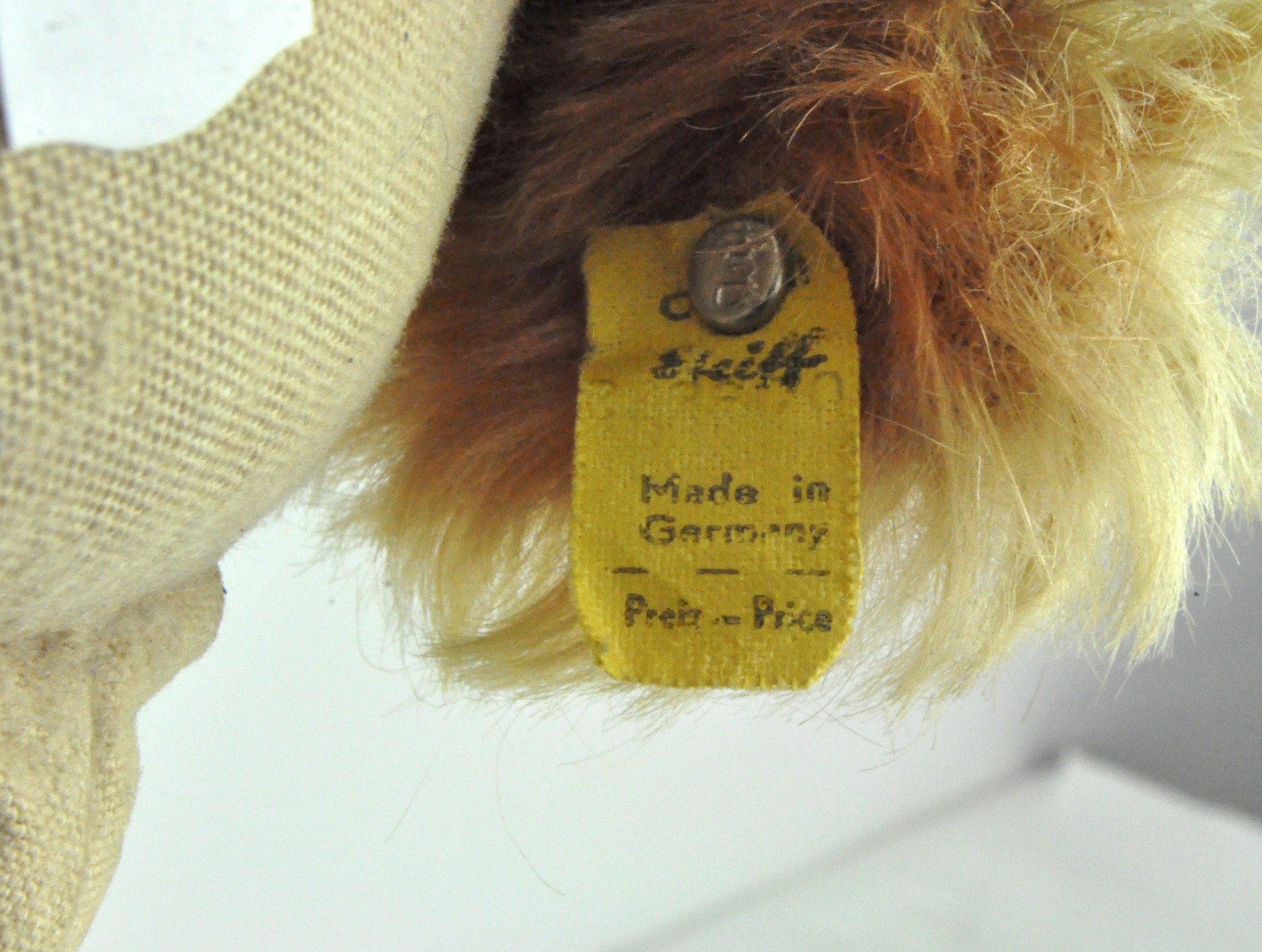 A rare 1950's Steiff Waldili Hunter dog, wearing green trousers, with yellow label and metal button, - Image 2 of 2
