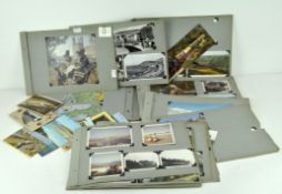 An Edwardian photograph album mounted with vintage postcards,