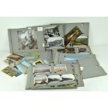 An Edwardian photograph album mounted with vintage postcards,
