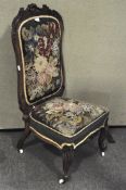 A Victorian mahogany chair, with carved scrolling decorating to the back,