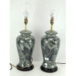 A pair of Chinese celadon ground lamp bases,