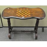 A side table with Victorian shaped top inlaid with a chessboard framed by two flower roundels,
