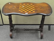 A side table with Victorian shaped top inlaid with a chessboard framed by two flower roundels,