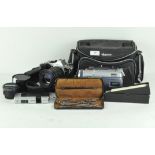 A collection of assorted cameras and lenses, including a AGFAmatic 4008, Tamron 521513 lens,