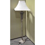 A modern bronze effect standard lamp, the pole itself of column form, with shade,
