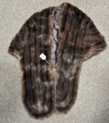 A mid-century mink fur stole, with corresponding brown lining, 53 cm across shoulders,