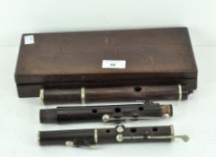 A vintage wooden and white metal mounted flute by HY Potter (London), stamped, in five parts,