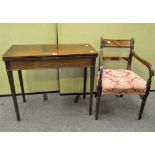 A Georgian mahogany folding card table and a Regency mahogany armchair,