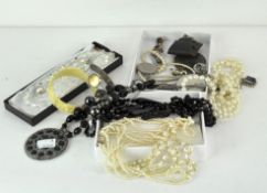 A collection of assorted costume jewellery, including necklaces, a silver mounted pendant, watches,