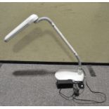 A white Ott-Line adjustable desk lamp, model K418KR-UK,