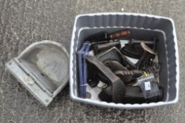 A box of assorted metalware, including Victorian irons,