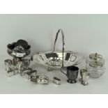 A collection of silver plated items including a basket, egg cups, napkin rings, a footed bowl,