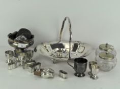 A collection of silver plated items including a basket, egg cups, napkin rings, a footed bowl,