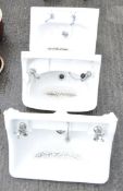 Three antique ceramic sinks, including a Twyford example,