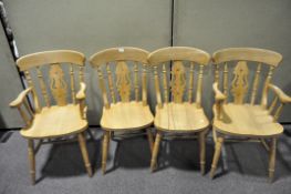 Four fiddle back beech chairs on turned supports, including two carvers,
