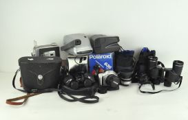 Various vintage cameras and lenses, including Pentax Asahi,