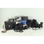 Various vintage cameras and lenses, including Pentax Asahi,