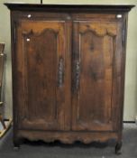 A French wooden wardrobe, carved doors with Art nouveau style metal applications,