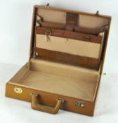 A vintage 1960's leather briefcase, (with keys),