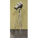 A Major industrial electric light, with adjustable stand, supported on a tripod base,