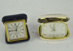 A 1940's Jaeger-LeCoultre travelling alarm clock together with a Europa example
