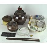 A collection of stoneware and other items in a vintage wooden apple box