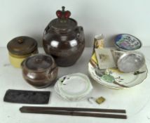 A collection of stoneware and other items in a vintage wooden apple box