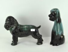 Two large pottery models of dogs, 20th century, each glazed in graduated turquoise hues,