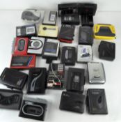 A large collection of assorted Walkman players including Sony