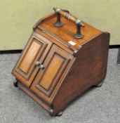 A late 19th/early 20th century mahogany coal scuttle,