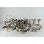 A large group of vintage and early 20th century silver plate including tea and coffee pots, vases,