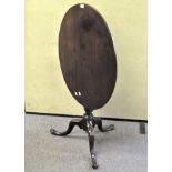 A 19th century mahogany tilt top table, of oval form,