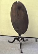 A 19th century mahogany tilt top table, of oval form,