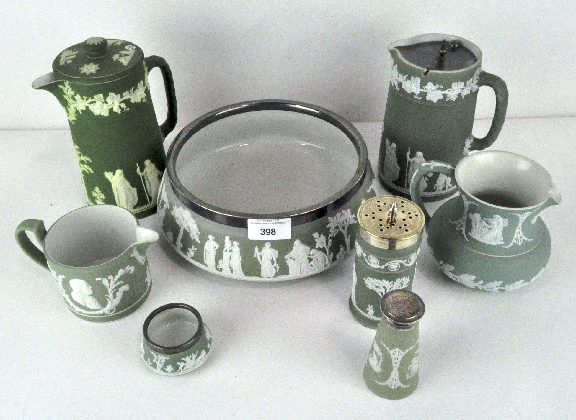A collection of eight Wedgwood dipped green jasperware pieces,