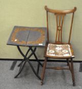 An early 20th century poker work occasional folding table together with a small chair