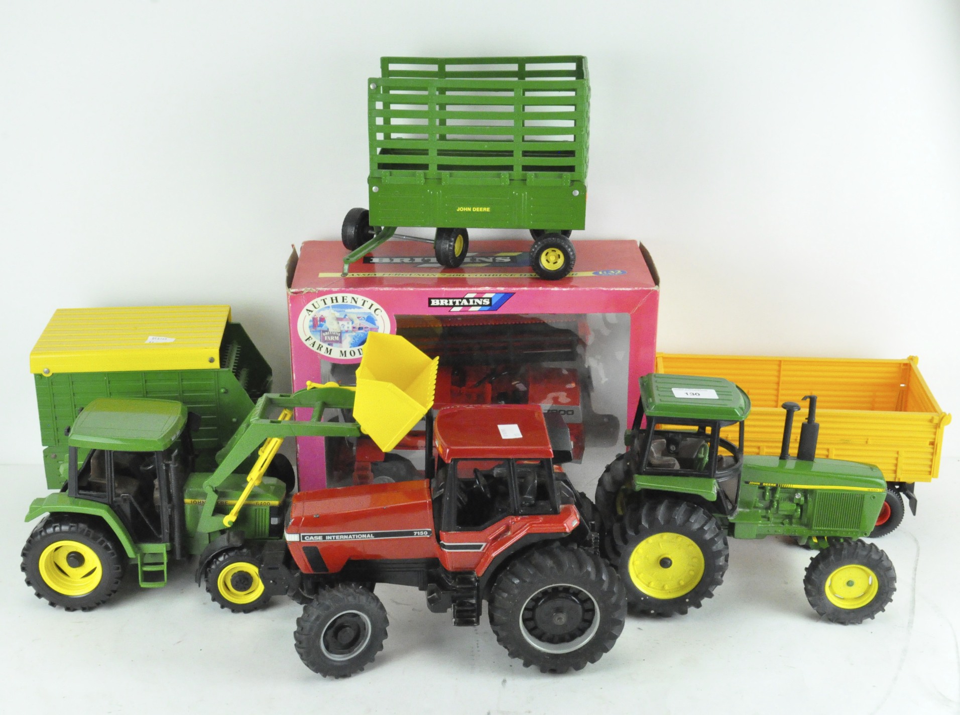 A selection of model tractors and related farming equipment,